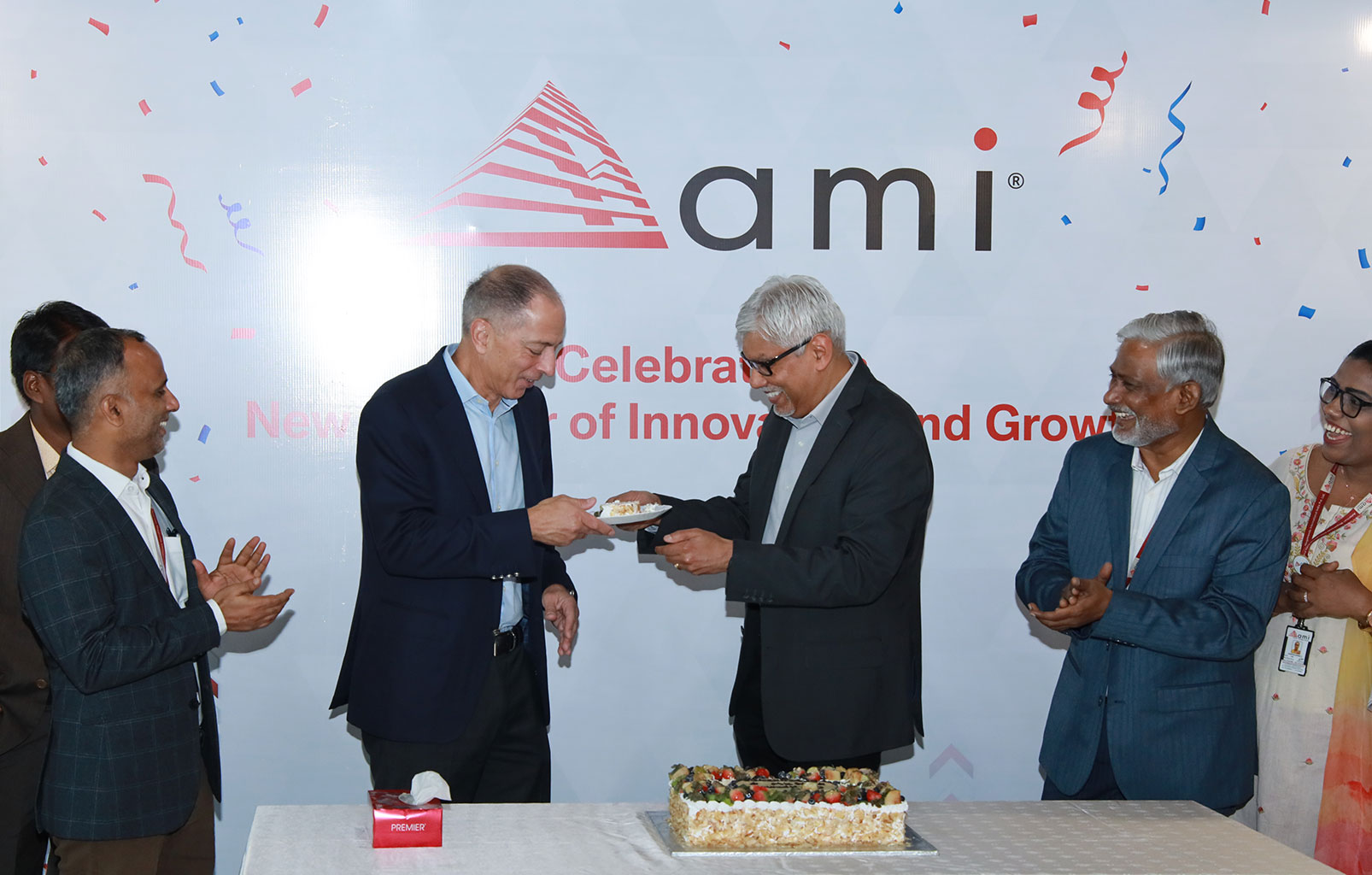Celebrating with cake at the grand opening of the new AMI office in Chennai
